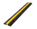 Single-channel cable protector ramp for hire by Glow Power Rental, Dubai UAE — black and yellow rubber cable ramp for one cable run