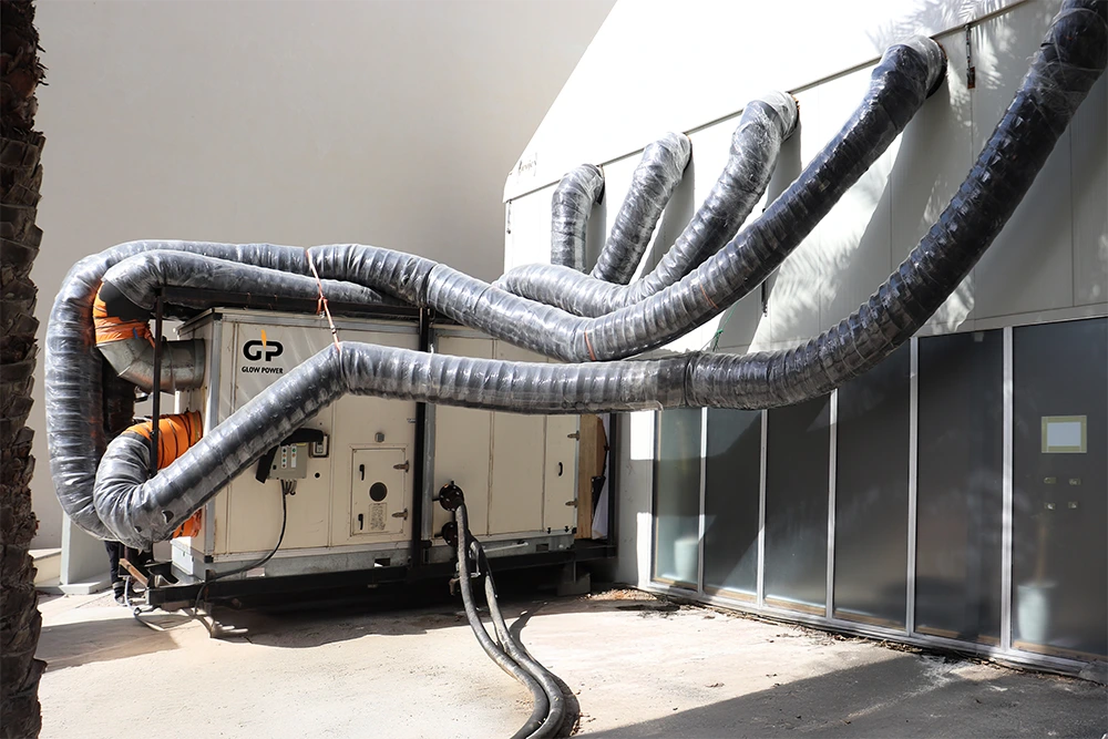 Portable AC units connected to a temporary Ramadan tent with flexible ducting