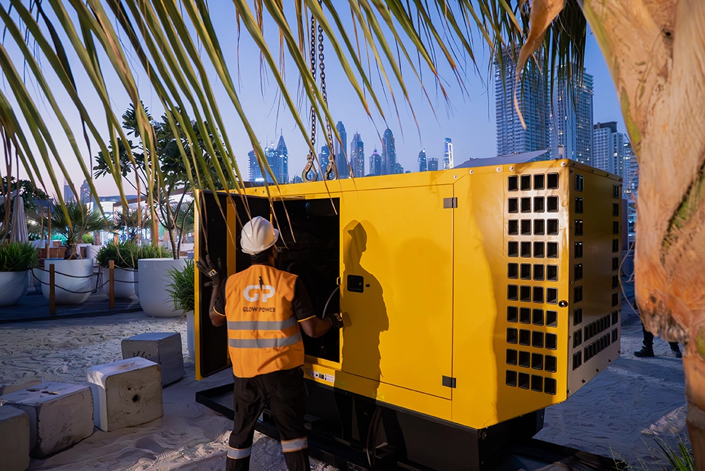 Glow Power Rental technician connecting an emergency generator at a commercial facility